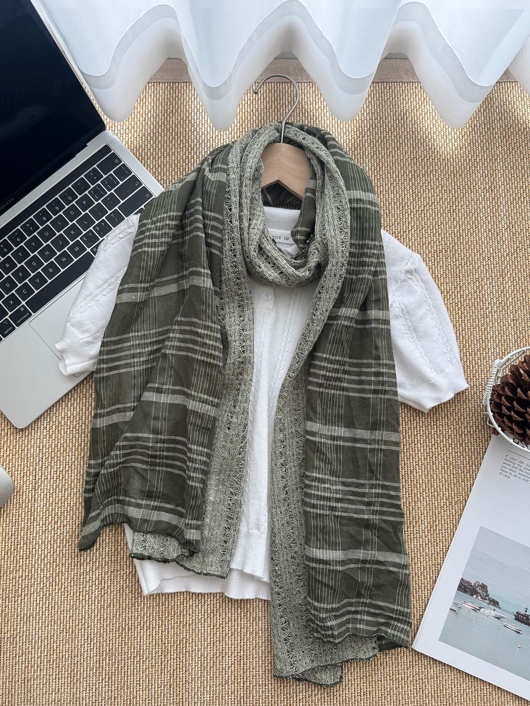 Army Green scarf arranged over a white top with broad plaid sections and an openwork center.