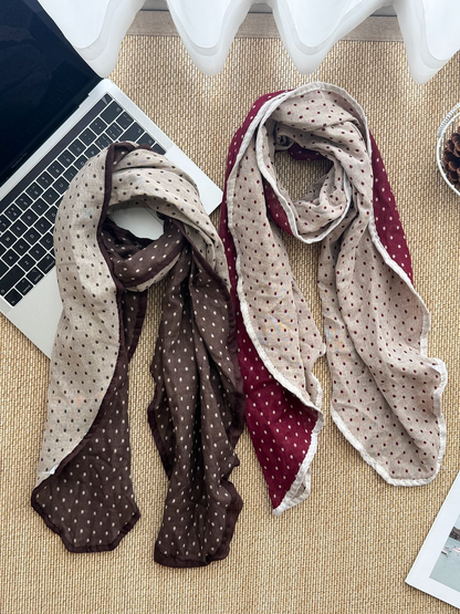 Dark Brown and Burgundy polka dot scarves arranged in long loops with contrasting pale sides exposed.