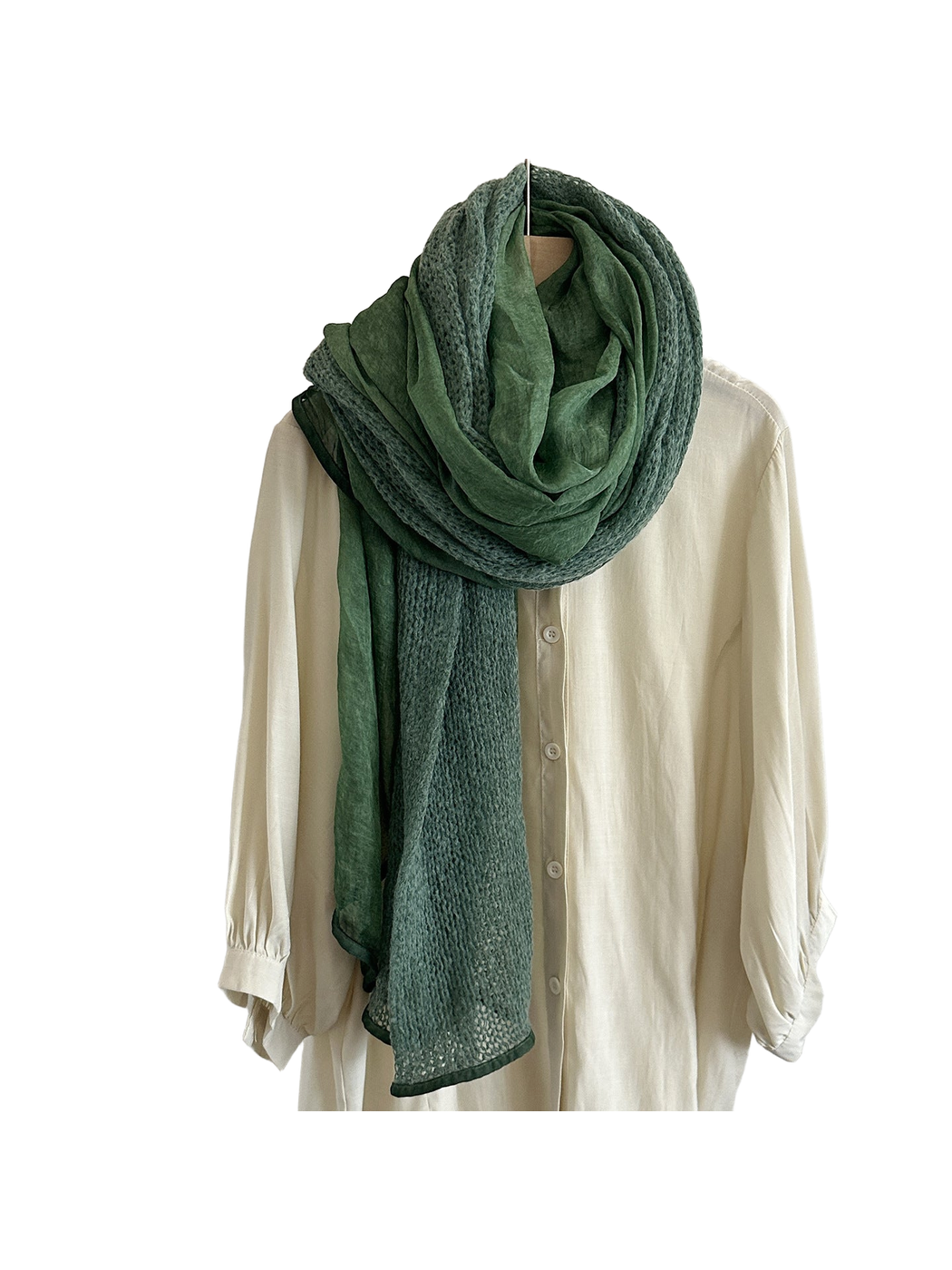Dark Green scarf with openwork and sheer panels looped over a cream shirt.