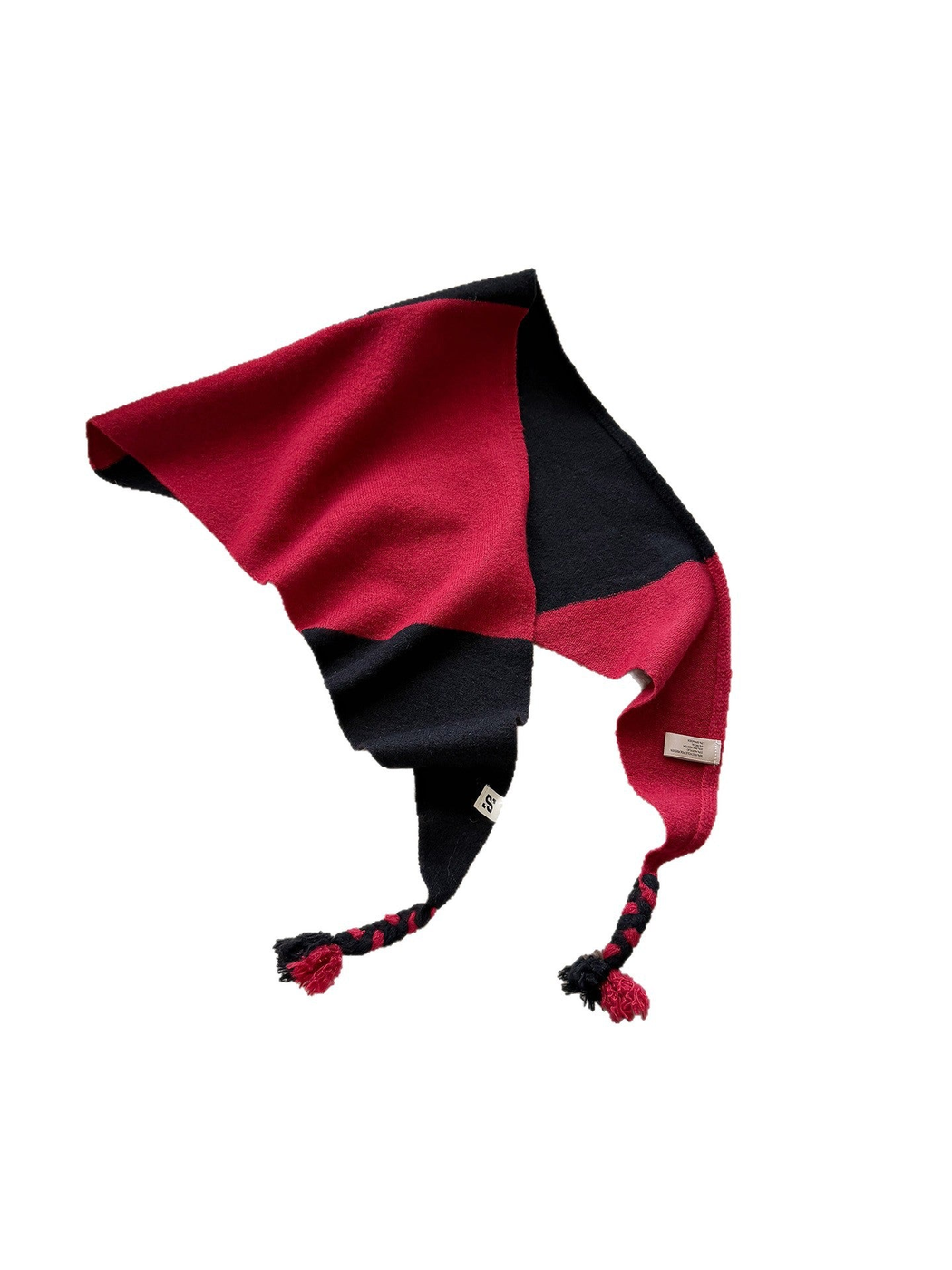 Rose Red triangle scarf with black color blocks and braided tassel ends on white