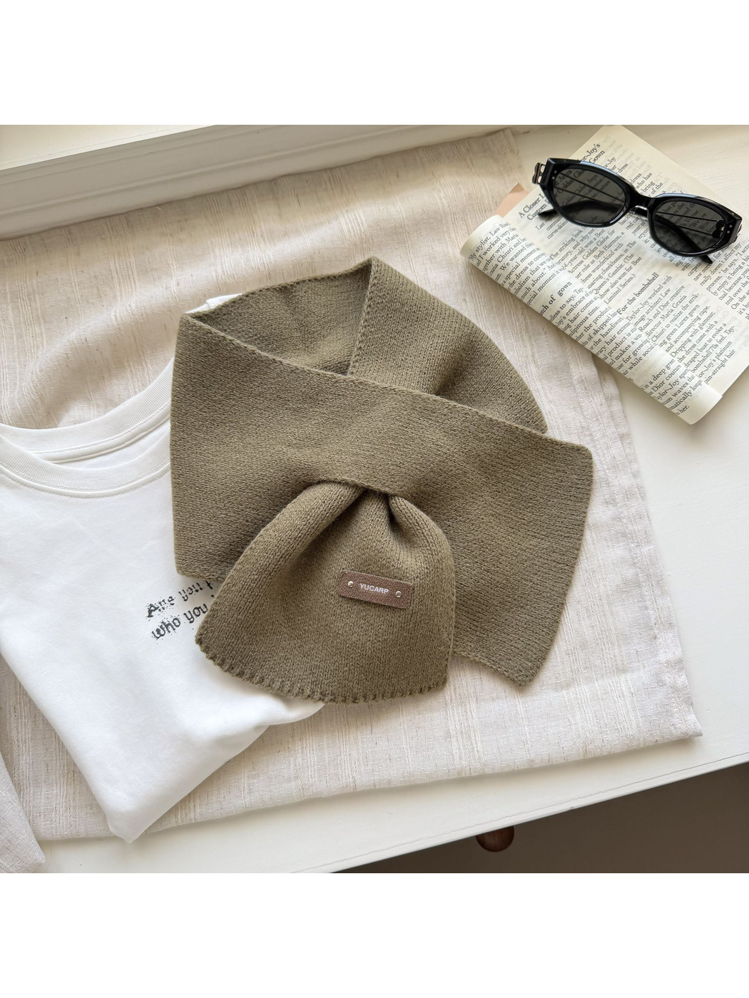 Dark Khaki knit pull-through scarf arranged with crossed ends.