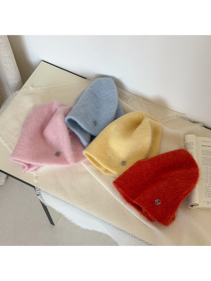 Light Pink, Light Blue, Yellow and Orange Red fuzzy knit beanies arranged with open lower edges.