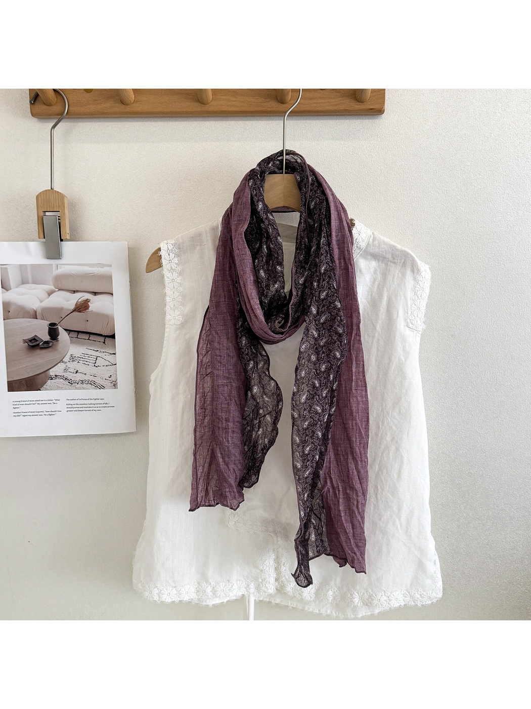 Purple Burgundy scarf with solid and paisley sections looped over a white top.