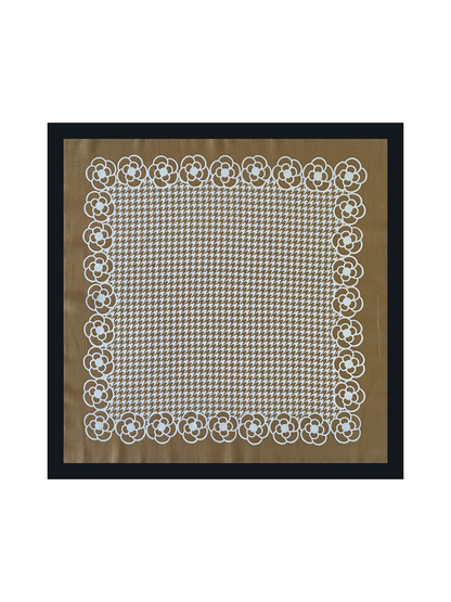 Camel square scarf spread flat with a white houndstooth center, floral border and black edge.