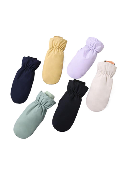 Navy, yellow, purple, green, black and ivory mittens arranged on a white background.