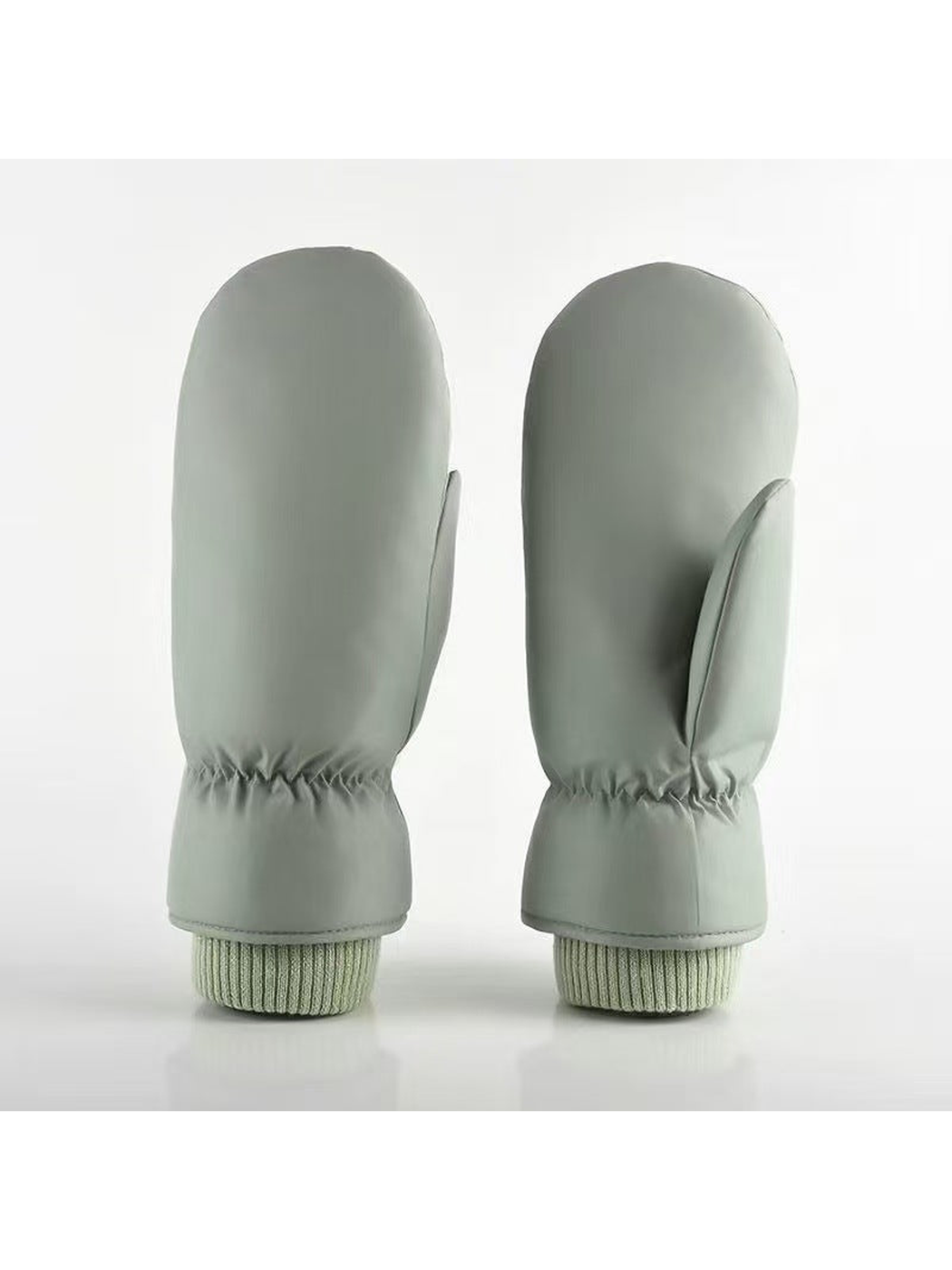 Green Smooth mittens with separate thumbs and ribbed cuffs.