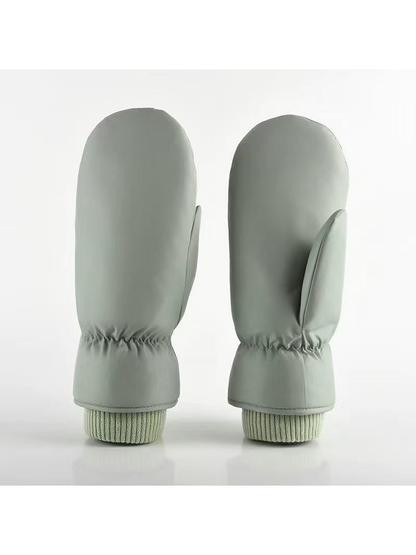 Green Smooth mittens with separate thumbs and ribbed cuffs.