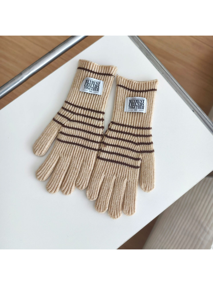 Beige ribbed gloves with brown horizontal stripes and rectangular cuff patches.