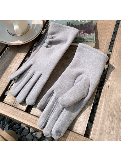 Light Gray gloves with three button accents and a circular stitched accent, displayed on a slatted table.