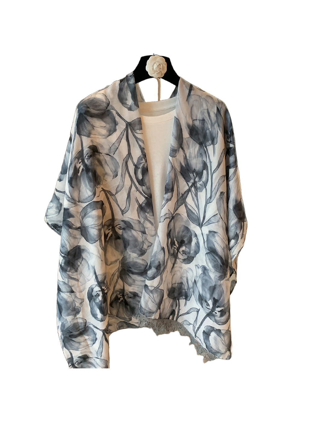 Gray-blue and ivory floral scarf with fringe trim, full draped view