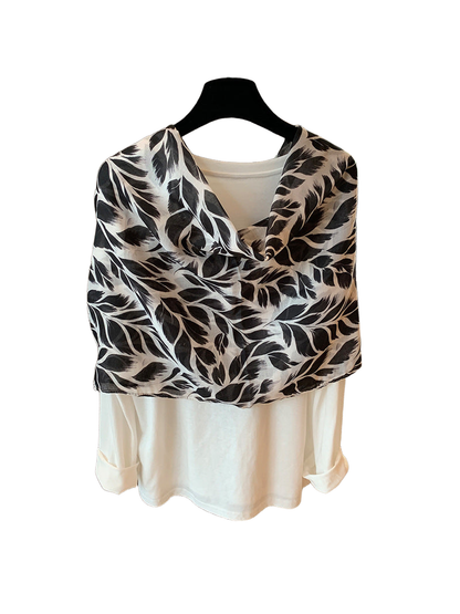 Black-and-white rectangular scarf with a leaf pattern and black lace trim, broad drape view