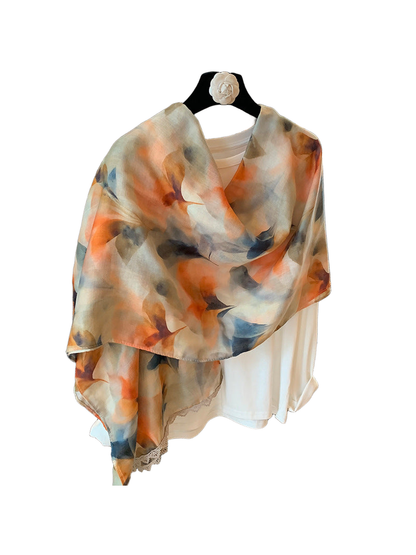 Multicolor abstract floral scarf draped over a white top, rear view