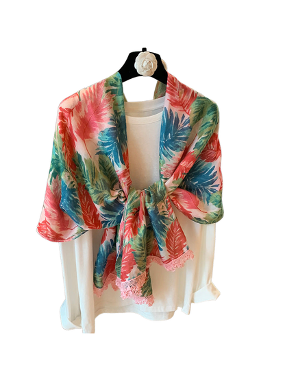 Multicolor floral scarf tied at the front with pink lace trim