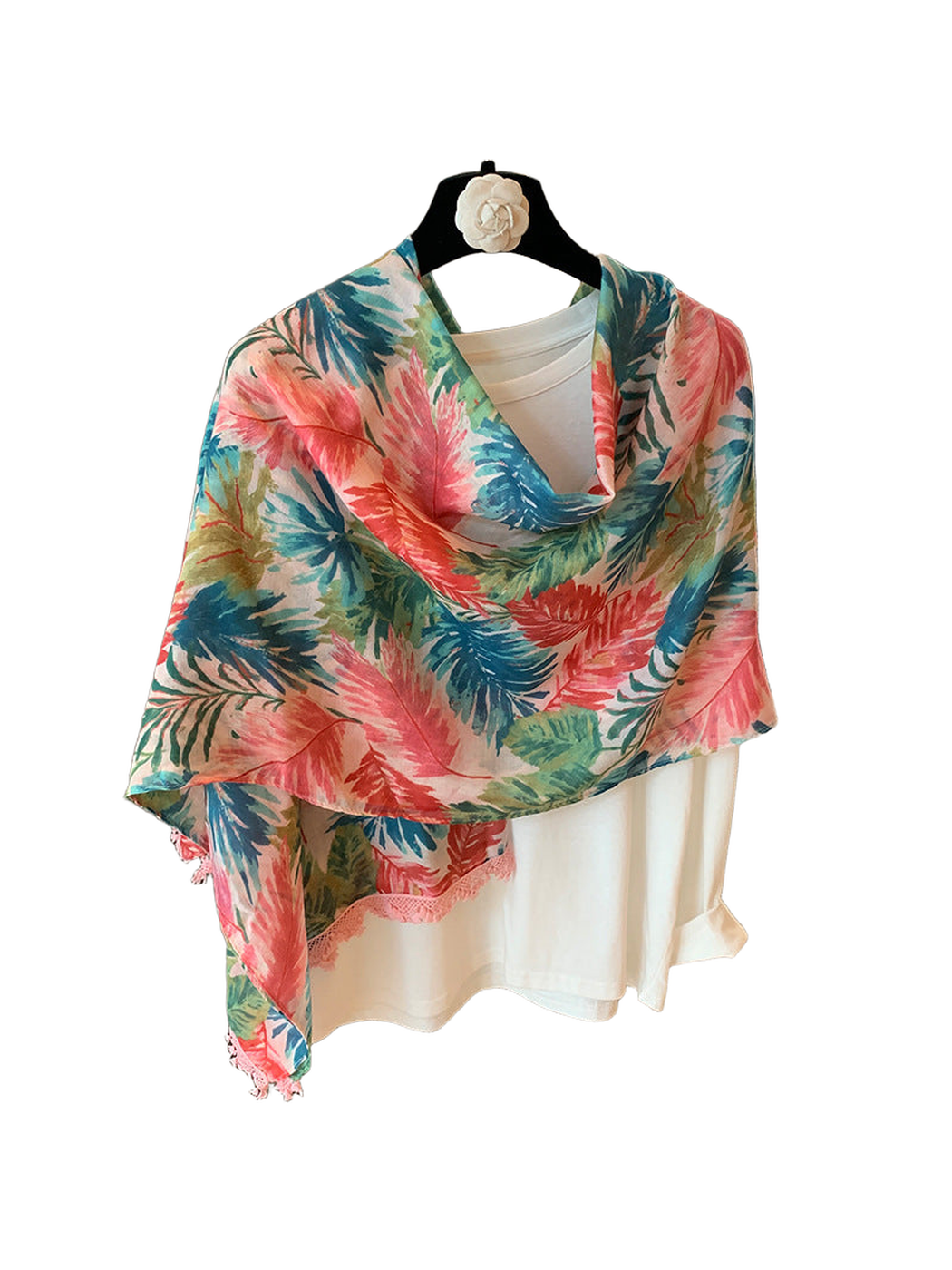 Multicolor floral scarf draped across a white top with pink lace trim
