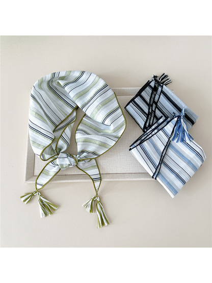 Green triangle scarf with folded Blue Gray and Black Gray scarves displayed together