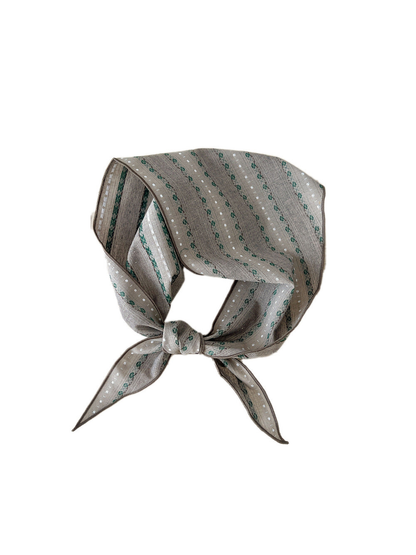 Gray Floral triangle scarf tied in a loop