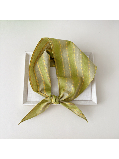 Yellow Floral triangle scarf tied in a loop