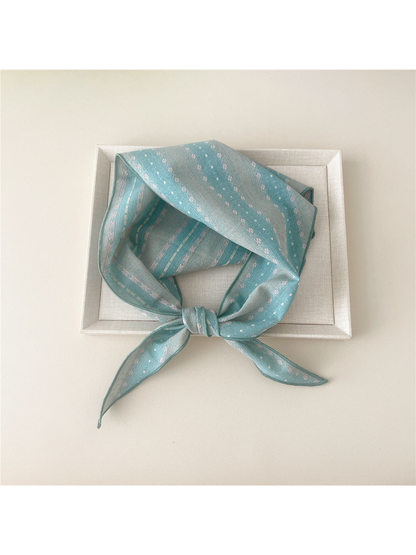 Blue Floral triangle scarf tied in a loop
