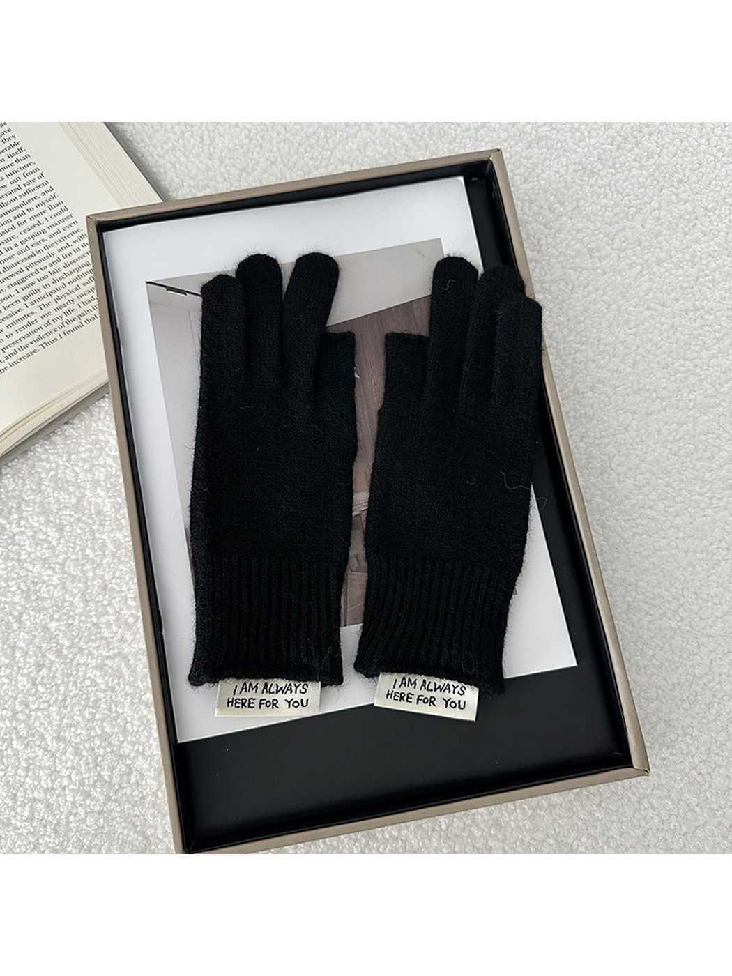 Black gloves displayed as a pair