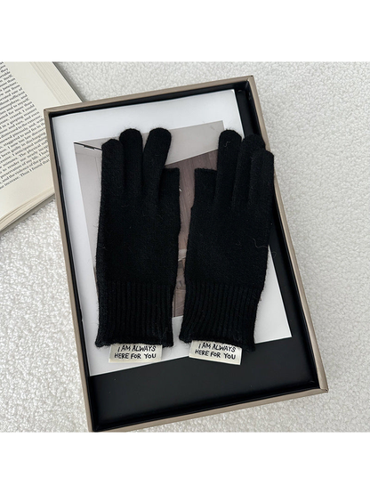 Black gloves displayed as a pair