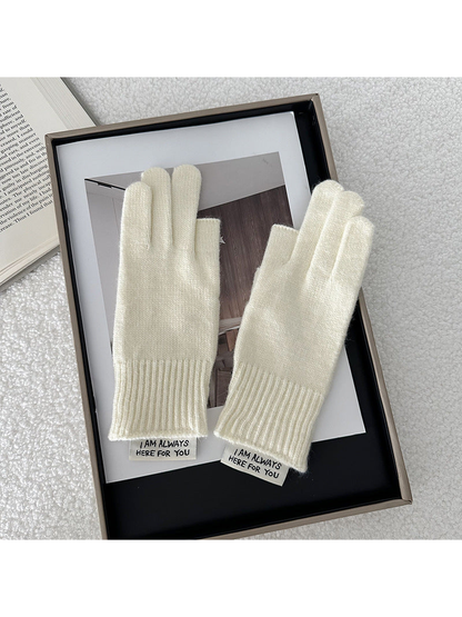 Ivory gloves displayed as a pair