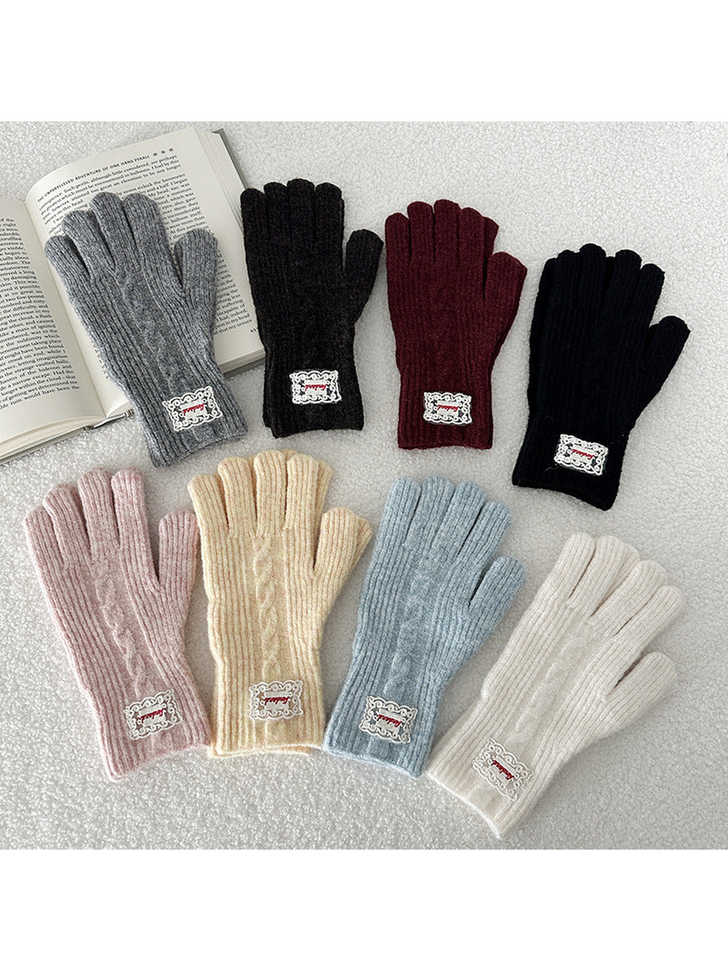 Multiple color variants of ribbed cable-knit gloves displayed together