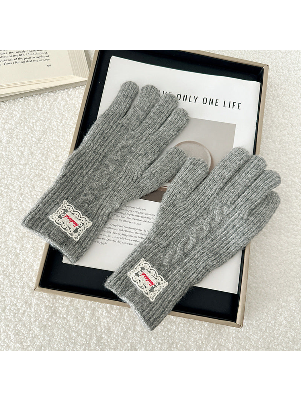 Gray cable-knit gloves with ribbed cuffs