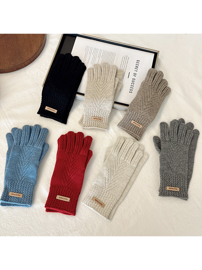Multiple colors of five-finger gloves displayed together