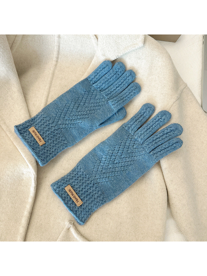 Blue five-finger gloves with textured cuffs and chevron-like openwork lines