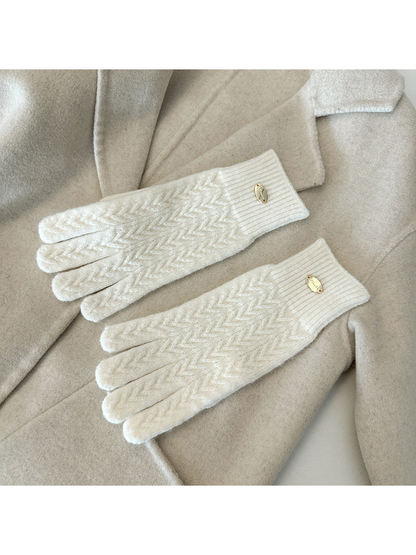 Ivory five-finger gloves with a repeating chevron knit pattern