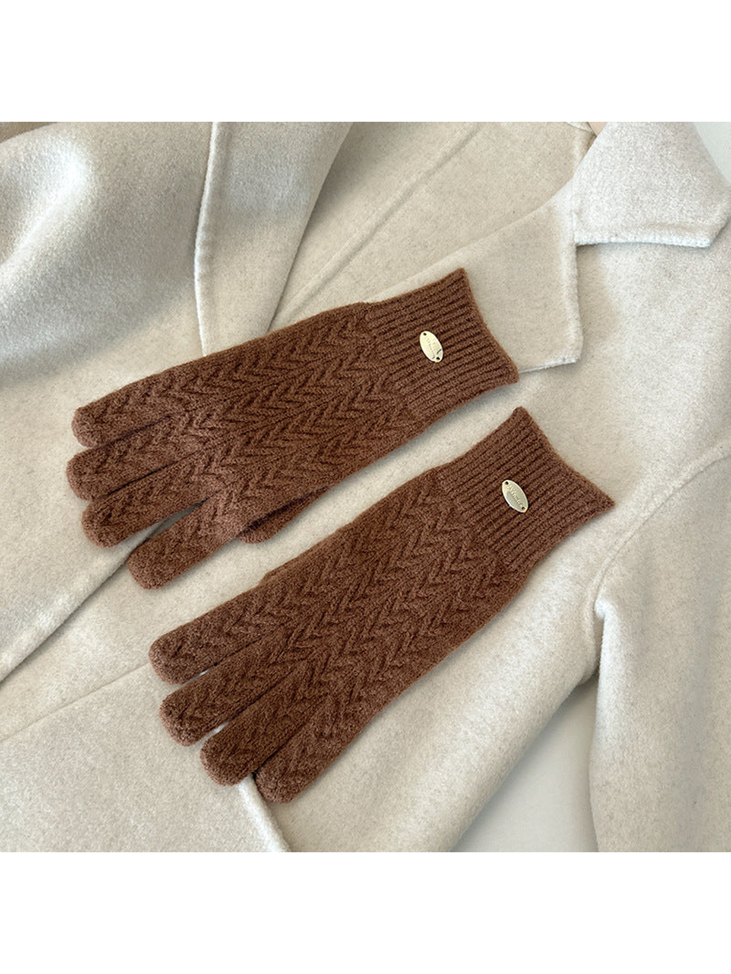 Caramel five-finger gloves with a repeating chevron knit pattern