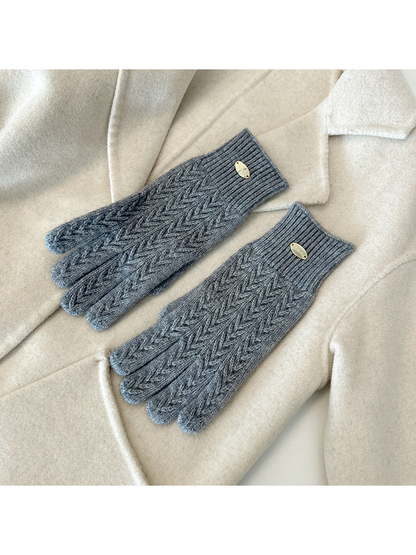 Gray five-finger gloves with a repeating chevron knit pattern