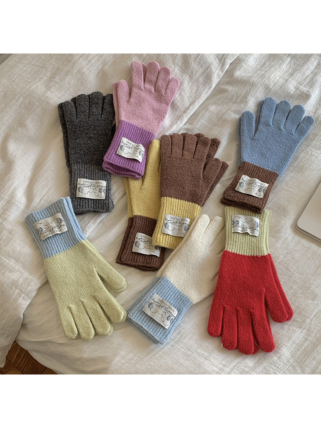 Multiple color options of five-finger gloves displayed together