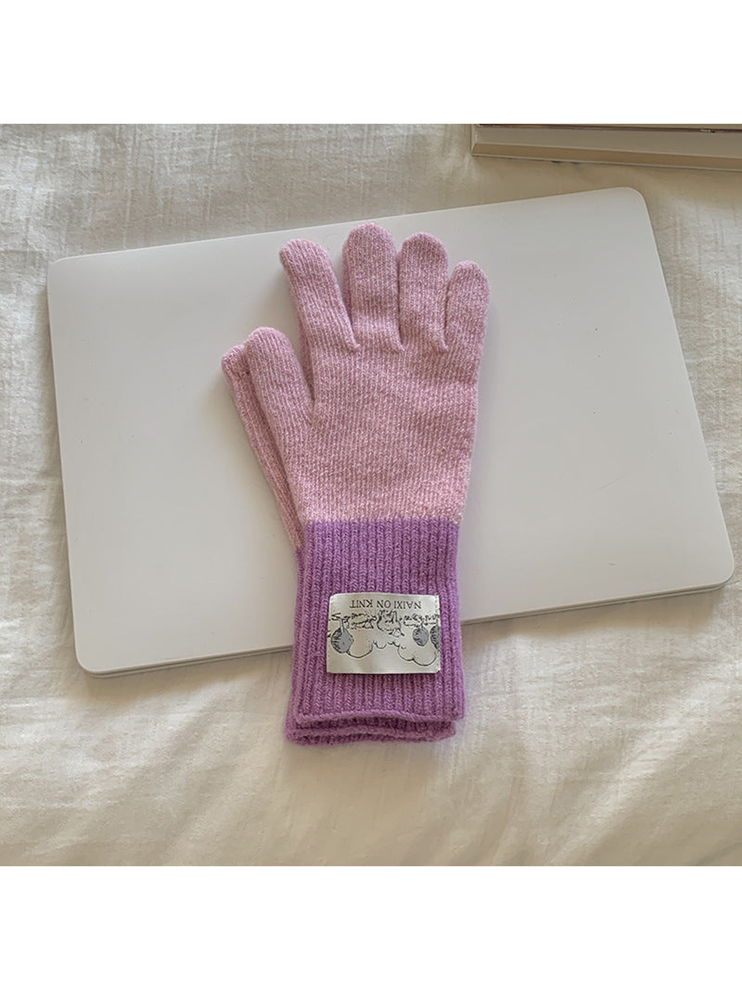 Pink gloves with purple cuffs, front view
