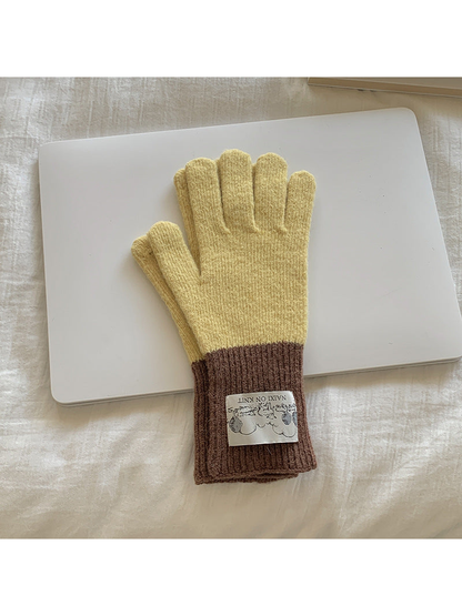 Yellow gloves with brown cuffs, front view