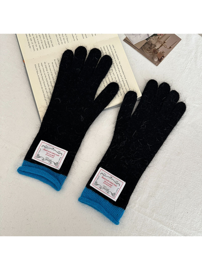 Black gloves with bright blue ribbed cuffs