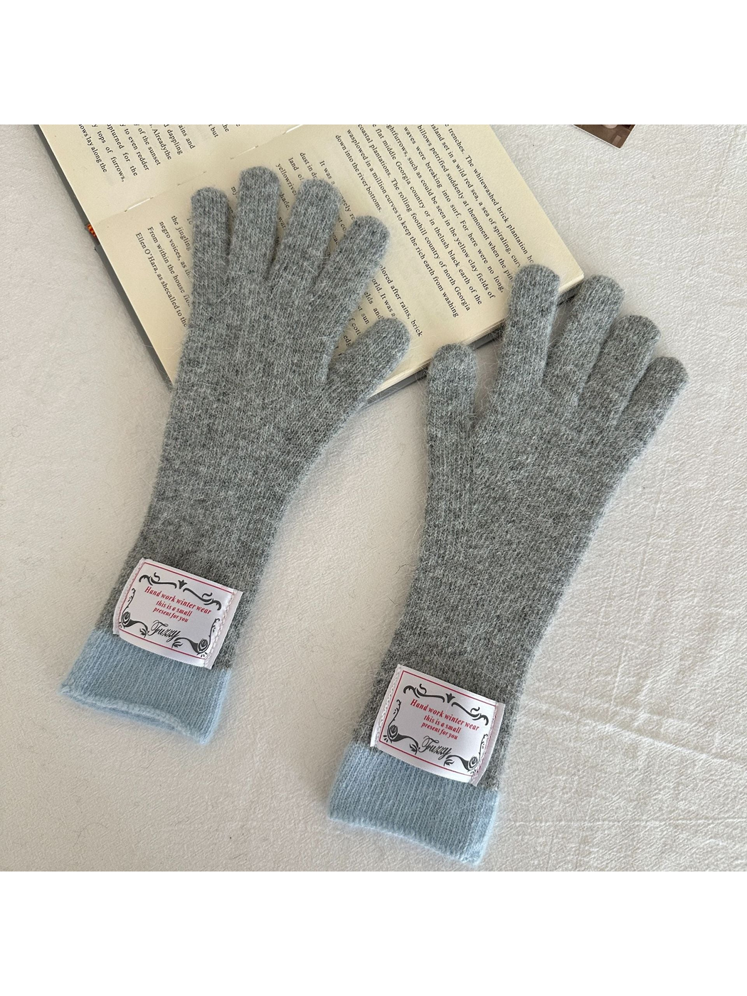 Gray gloves with pale blue-gray ribbed cuffs