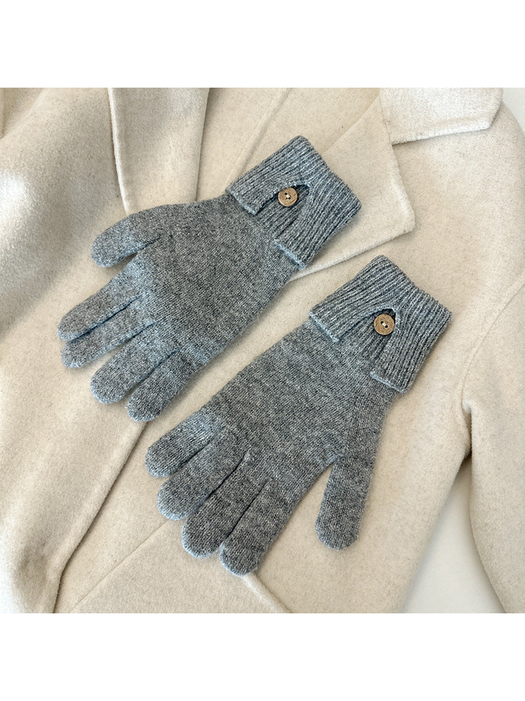 Gray gloves with ribbed cuffs and button details