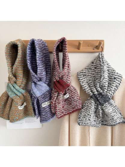 Four colorways of fuzzy knit scarves displayed together
