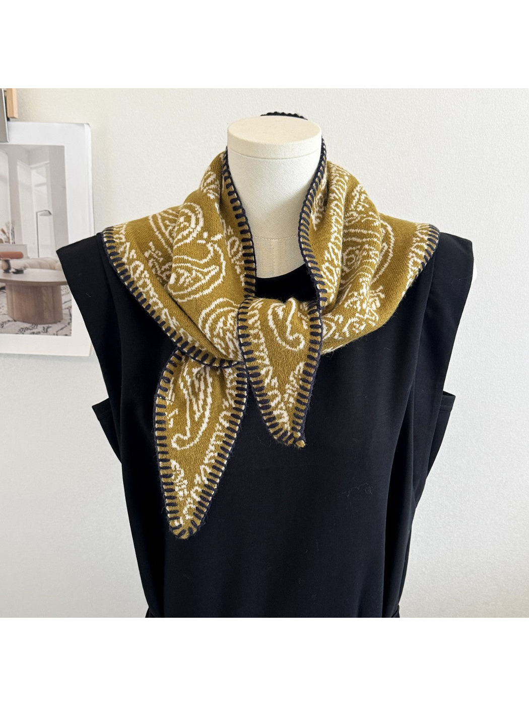 Mustard Yellow paisley scarf styled on a black mannequin
