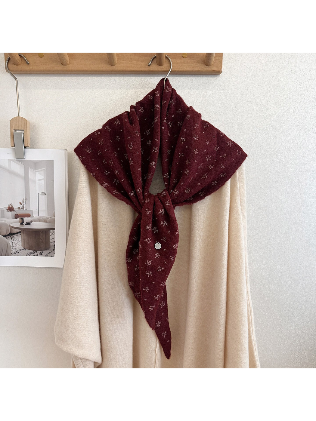 Burgundy scarf with small floral motifs, tied display