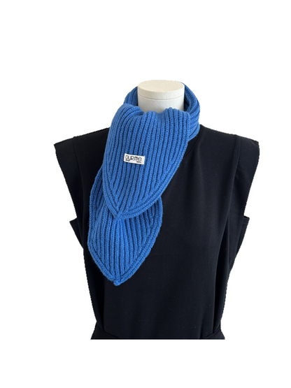 Blue ribbed knit scarf with pointed ends displayed on a mannequin