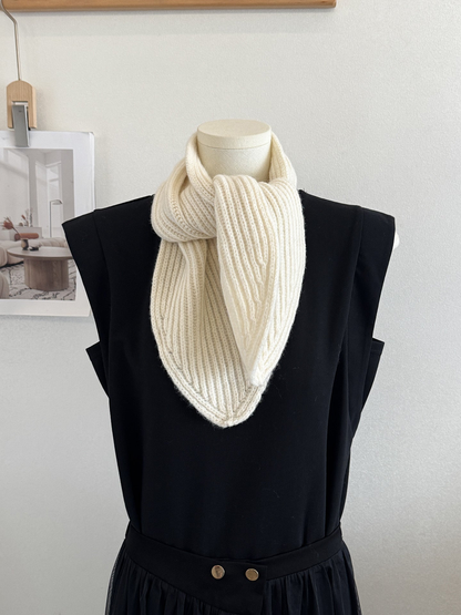 Ivory ribbed knit scarf with pointed ends on a mannequin