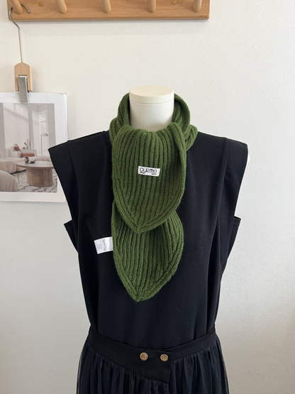 Army green ribbed knit scarf with pointed ends on a mannequin
