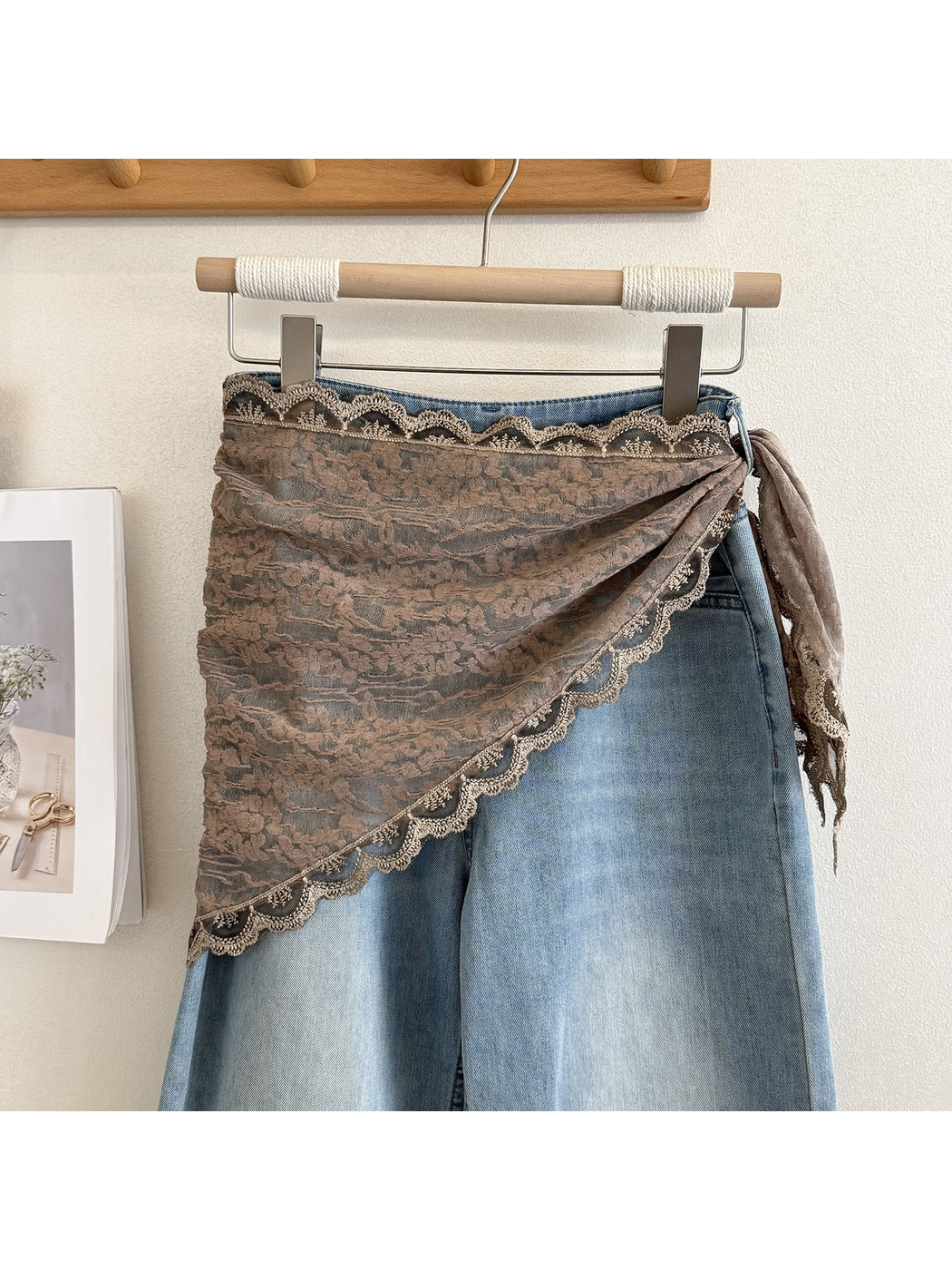 Light Coffee scarf with floral texture and scalloped lace trim draped over light-wash jeans