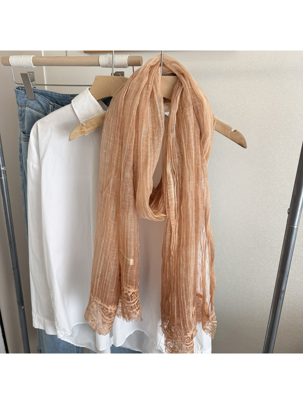 Caramel narrow scarf with floral lace trim, hanging display