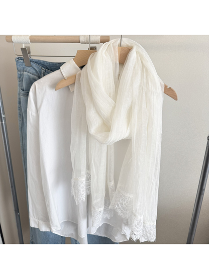Ivory narrow scarf with floral lace trim, hanging display