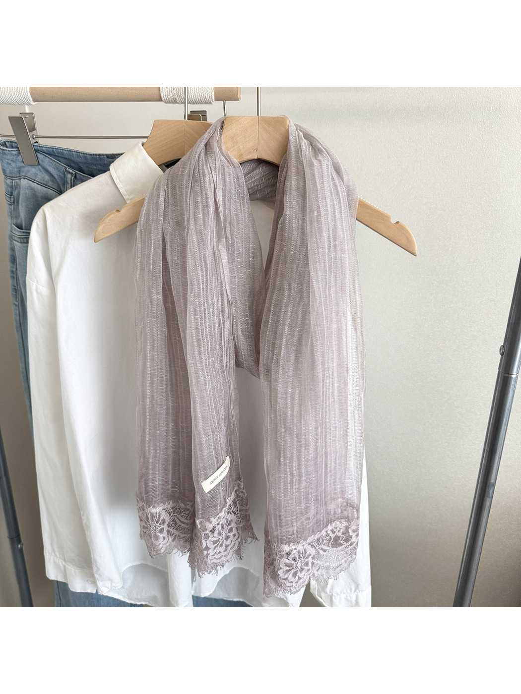 Light Purple narrow scarf with floral lace trim, hanging display