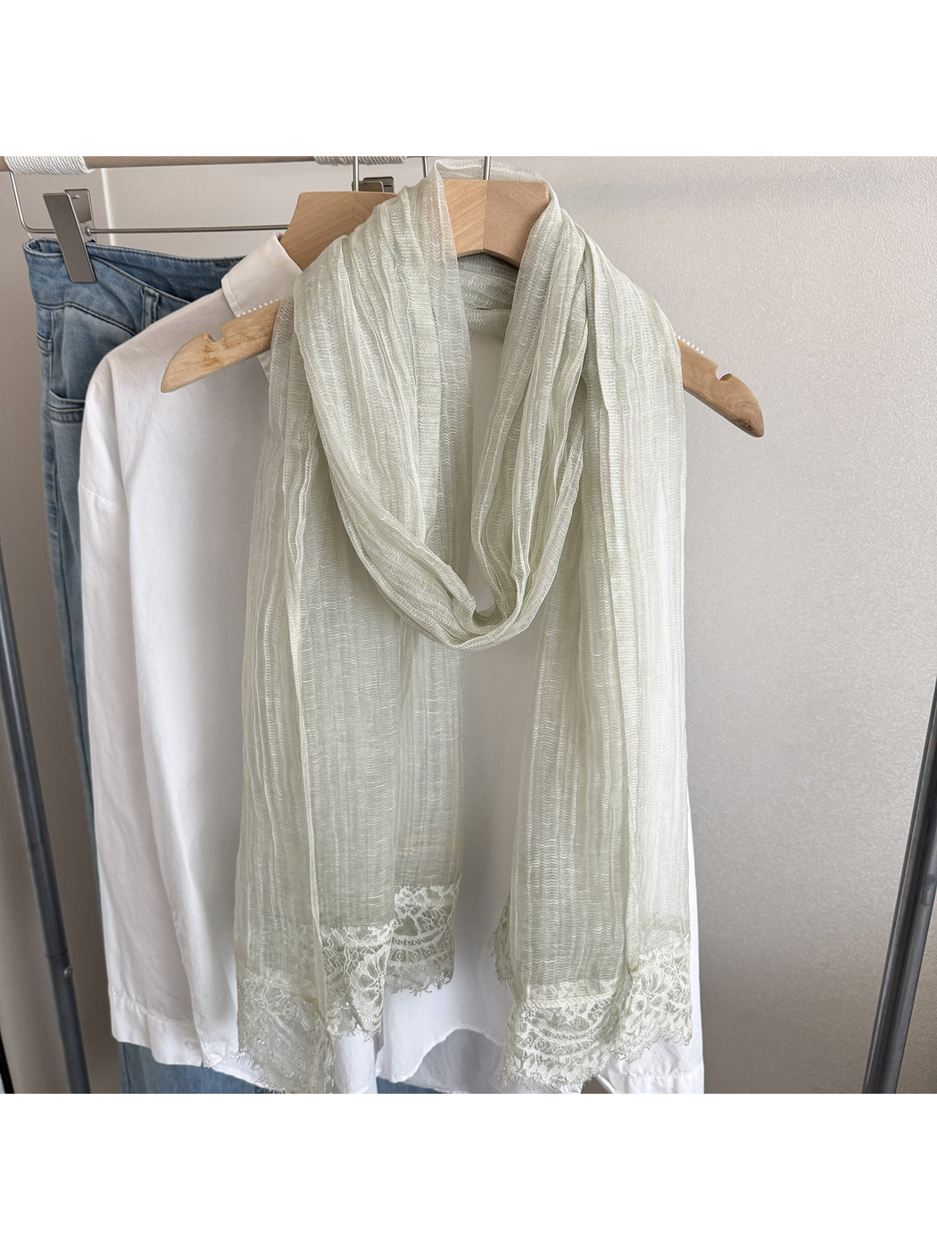Mint narrow scarf with floral lace trim, hanging display