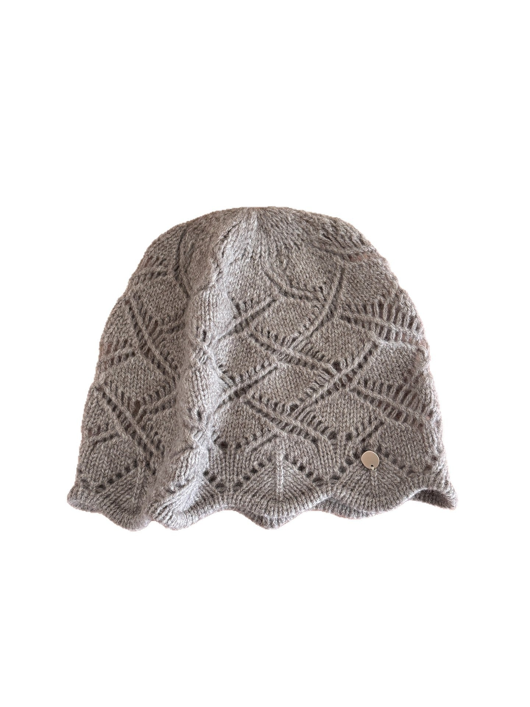 Cable-knit beanie with earflap and short visor-like brim on a white background